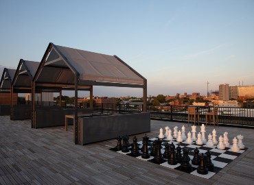High-rise rooftop photo with outdoor chess made doable by MagicPak installation